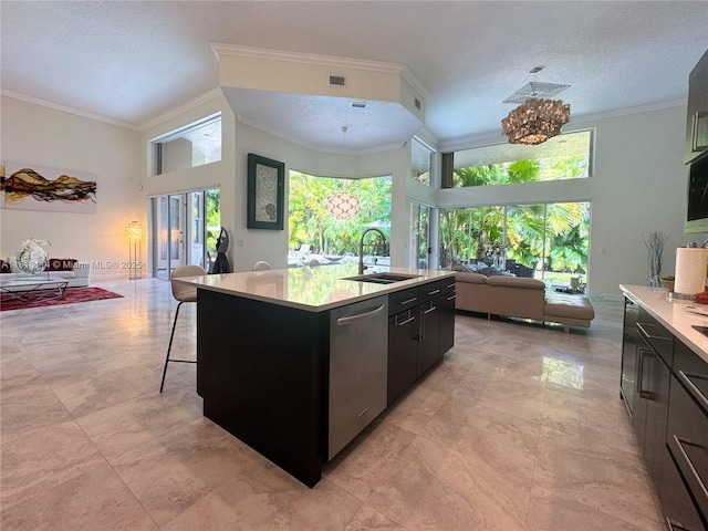 375 Sabal Way, Weston, FL 33326 - kitchen featuring stainless steel dishwasher, open floor plan, light countertops, dark cabinets, and ornamental molding