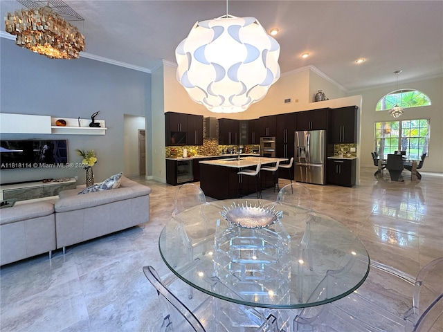 375 Sabal Way, Weston, FL 33326 - living area with a chandelier, light marble finish flooring, and crown molding