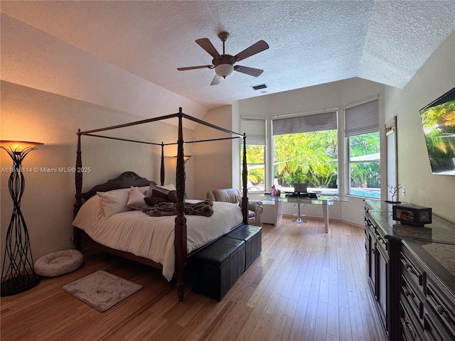 375 Sabal Way, Weston, FL 33326 - bedroom with vaulted ceiling, a textured ceiling, light wood finished floors, and ceiling fan