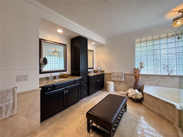 375 Sabal Way, Weston, FL 33326 - bathroom featuring ornamental molding, vanity, a bath, a wainscoted wall, and tile patterned flooring