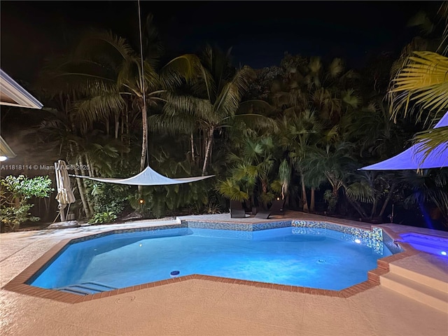 375 Sabal Way, Weston, FL 33326 - pool at night featuring an outdoor pool