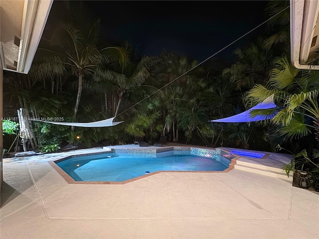 375 Sabal Way, Weston, FL 33326 - pool at twilight with a pool with connected hot tub and a patio area