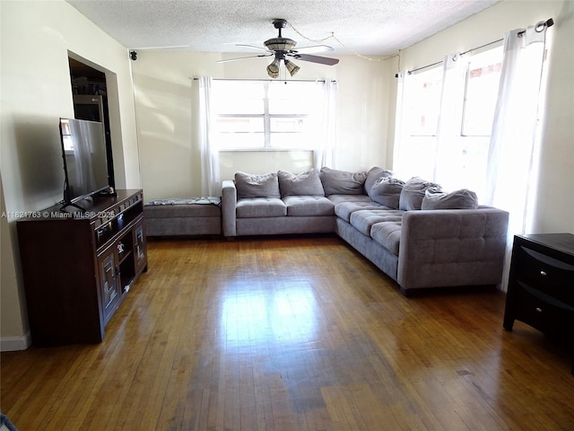 6680 SW 41st Pl Unit 32, Davie, FL 33314 - living area featuring a textured ceiling, a ceiling fan, and wood-type flooring