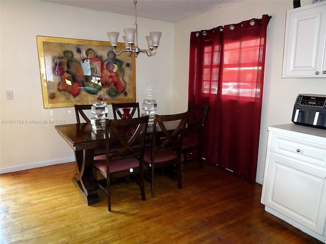 6680 SW 41st Pl Unit 32, Davie, FL 33314 - dining room featuring a chandelier and dark wood-type flooring