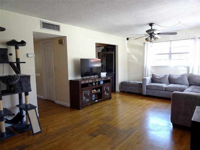 6680 SW 41st Pl Unit 32, Davie, FL 33314 - living area with ceiling fan, wood finished floors, and a textured ceiling