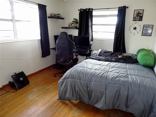 6680 SW 41st Pl Unit 32, Davie, FL 33314 - bedroom featuring wood finished floors and baseboards