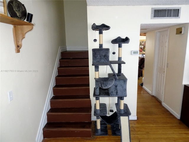 6680 SW 41st Pl Unit 32, Davie, FL 33314 - staircase with wood finished floors and baseboards