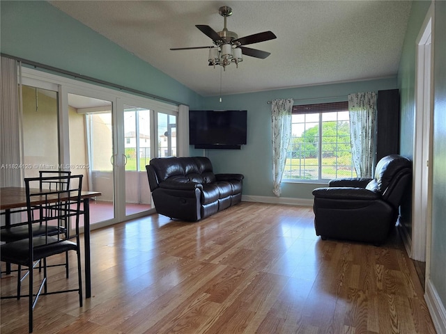 9410 S Meadows Cir, Miramar, FL 33025 - living area featuring lofted ceiling, wood finished floors, a ceiling fan, a textured ceiling, and french doors