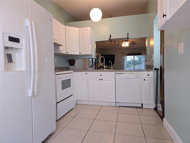 9410 S Meadows Cir, Miramar, FL 33025 - kitchen featuring white appliances, white cabinetry, light tile patterned floors, and under cabinet range hood