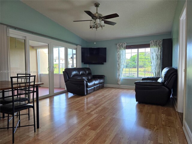 9410 S Meadows Cir, Miramar, FL 33025 - living area featuring lofted ceiling, wood finished floors, a ceiling fan, a textured ceiling, and french doors