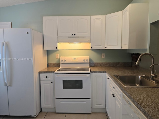 9410 S Meadows Cir, Miramar, FL 33025 - kitchen with white appliances, under cabinet range hood, white cabinets, and dark countertops
