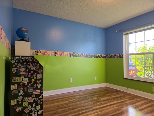 9410 S Meadows Cir, Miramar, FL 33025 - spare room featuring wood finished floors and a textured ceiling