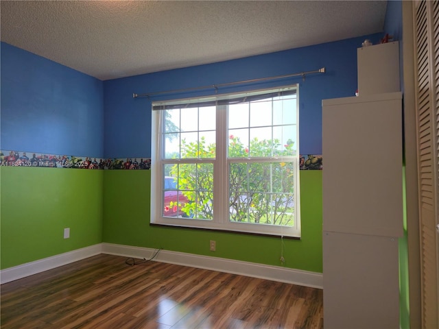 9410 S Meadows Cir, Miramar, FL 33025 - unfurnished room featuring wood finished floors, plenty of natural light, and a textured ceiling