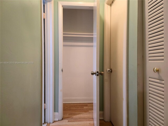 9410 S Meadows Cir, Miramar, FL 33025 - corridor featuring wood finished floors and baseboards
