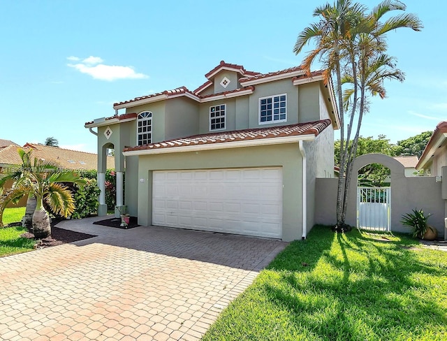 550 NW 107th Ave, Pembroke Pines, FL 33026 - mediterranean / spanish-style house with a garage, stucco siding, decorative driveway, and a tiled roof