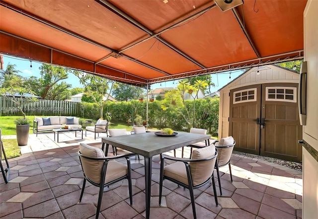 550 NW 107th Ave, Pembroke Pines, FL 33026 - fenced backyard with a patio area, outdoor dining space, outdoor lounge area, and a shed