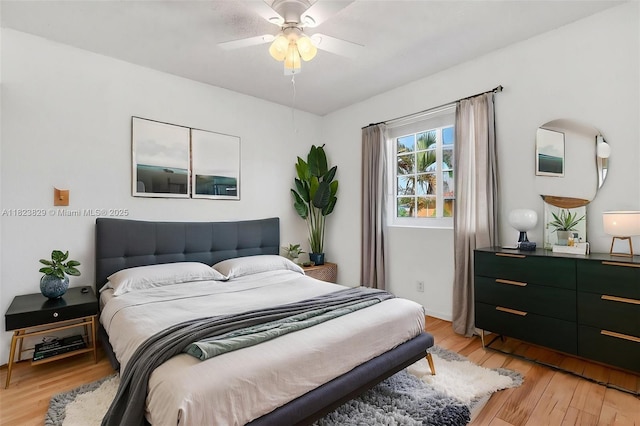 550 NW 107th Ave, Pembroke Pines, FL 33026 - bedroom with light wood finished floors and ceiling fan