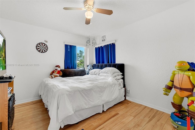550 NW 107th Ave, Pembroke Pines, FL 33026 - bedroom with light wood-style flooring and ceiling fan