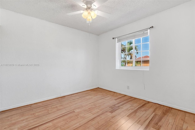550 NW 107th Ave, Pembroke Pines, FL 33026 - spare room featuring wood finished floors, a textured ceiling, and ceiling fan