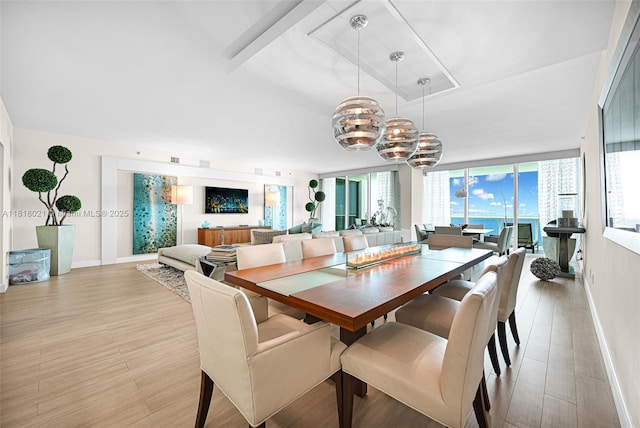 2711 S Ocean Dr Unit 3003, Hollywood, FL 33019 - dining space featuring a chandelier and light wood-type flooring