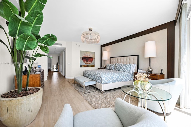 2711 S Ocean Dr Unit 3003, Hollywood, FL 33019 - bedroom featuring a chandelier and wood finished floors