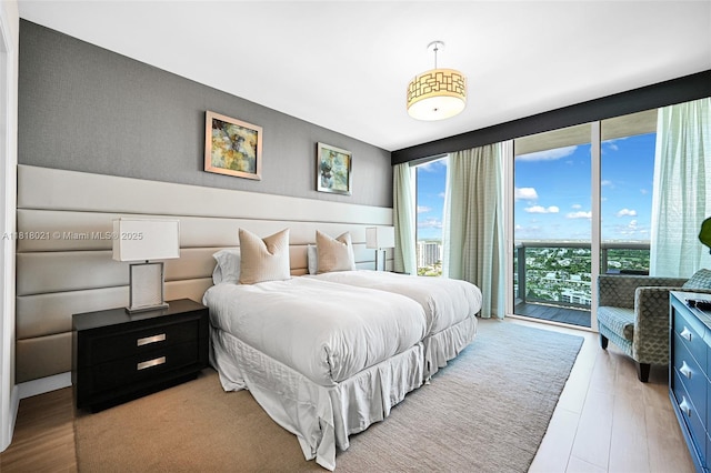 2711 S Ocean Dr Unit 3003, Hollywood, FL 33019 - bedroom with access to outside, wood finished floors, and floor to ceiling windows