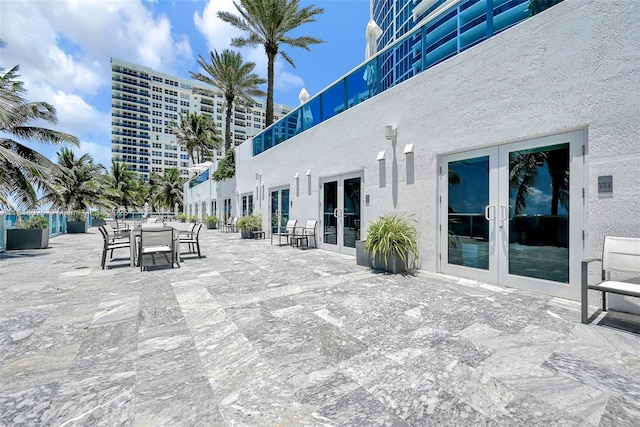 2711 S Ocean Dr Unit 203, Hollywood, FL 33019 - view of patio featuring french doors and outdoor dining area