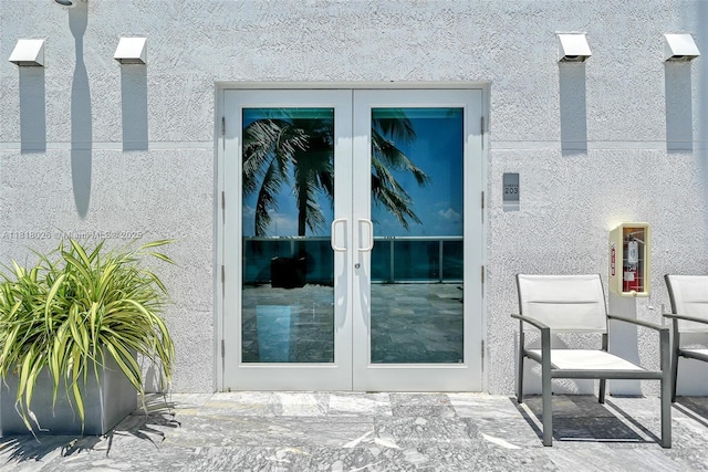 2711 S Ocean Dr Unit 203, Hollywood, FL 33019 - property entrance with french doors, a patio area, and stucco siding