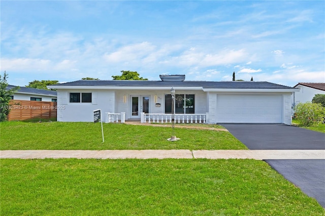3917 Adams St, Hollywood, FL 33021 - ranch-style house with asphalt driveway and a garage