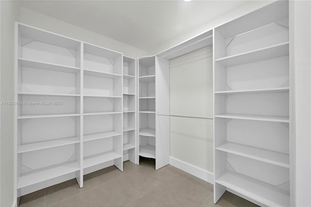 3917 Adams St, Hollywood, FL 33021 - walk in closet featuring tile patterned flooring