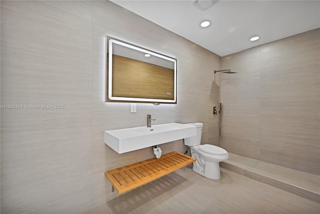 3917 Adams St, Hollywood, FL 33021 - bathroom featuring tile walls, a tile shower, tile patterned floors, and recessed lighting