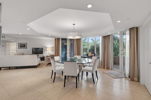 140 SE 5th Ave Unit 438, Boca Raton, FL 33432 - dining area featuring a tray ceiling, recessed lighting, and light tile patterned floors