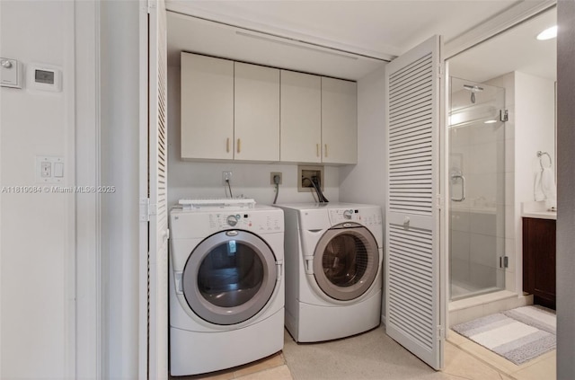 140 SE 5th Ave Unit 438, Boca Raton, FL 33432 - washroom featuring cabinet space and washer and dryer