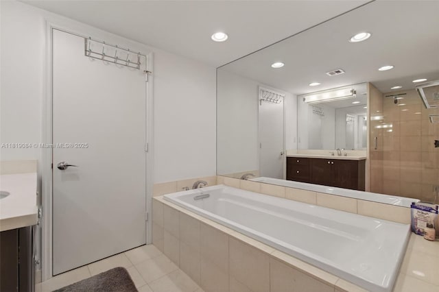 140 SE 5th Ave Unit 438, Boca Raton, FL 33432 - bathroom with vanity, a garden tub, tile patterned floors, a stall shower, and recessed lighting