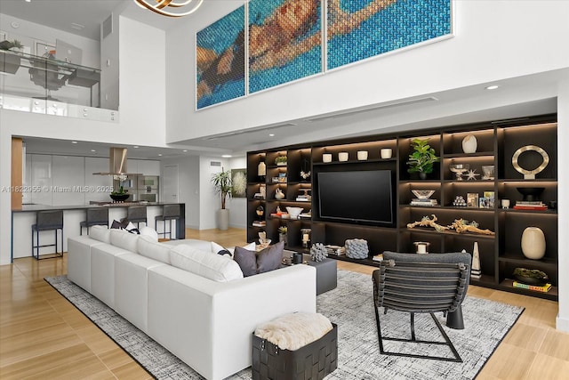 4701 N Meridian Ave Unit 217, Miami Beach, FL 33140 - living area with a towering ceiling and wood finished floors