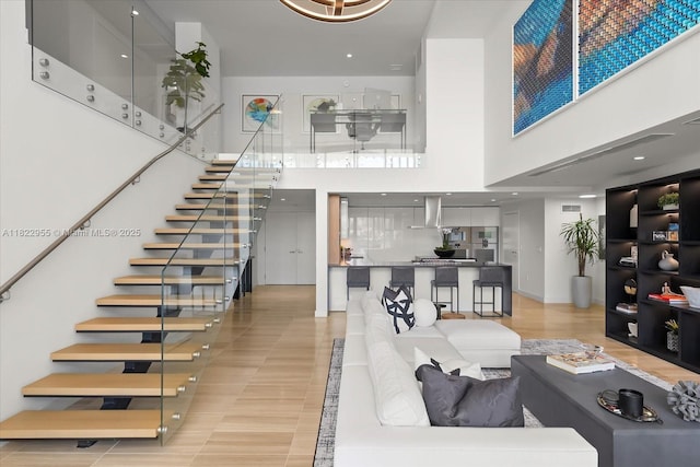 4701 N Meridian Ave Unit 217, Miami Beach, FL 33140 - living room with a high ceiling and stairs