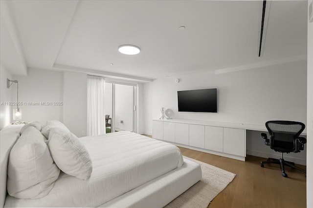 4701 N Meridian Ave Unit 217, Miami Beach, FL 33140 - bedroom featuring wood finished floors and a desk