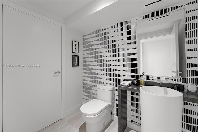 4701 N Meridian Ave Unit 217, Miami Beach, FL 33140 - bathroom with toilet and tile walls