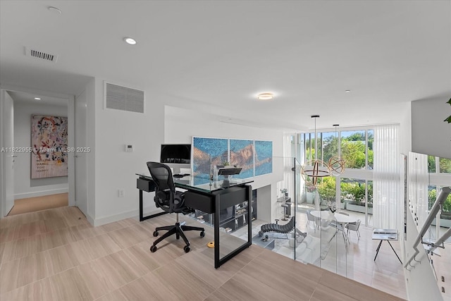 4701 N Meridian Ave Unit 217, Miami Beach, FL 33140 - home office featuring floor to ceiling windows and baseboards