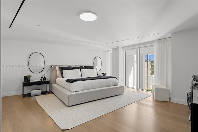 4701 N Meridian Ave Unit 217, Miami Beach, FL 33140 - bedroom featuring wood finished floors and access to outside