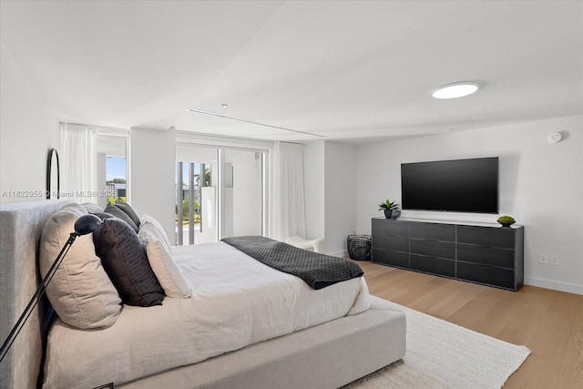 4701 N Meridian Ave Unit 217, Miami Beach, FL 33140 - bedroom with wood finished floors and access to exterior