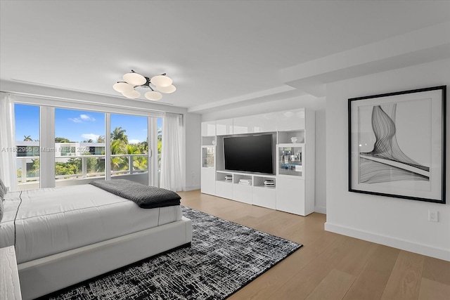4701 N Meridian Ave Unit 217, Miami Beach, FL 33140 - bedroom with light wood-style flooring and baseboards