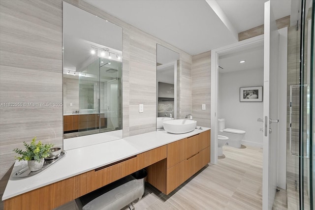4701 N Meridian Ave Unit 217, Miami Beach, FL 33140 - full bathroom with a bidet, vanity, a stall shower, and tile walls