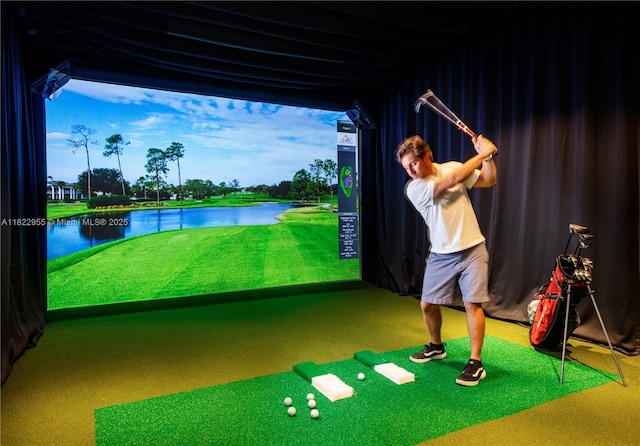 4701 N Meridian Ave Unit 217, Miami Beach, FL 33140 - rec room with golf simulator, carpet floors, and a water view