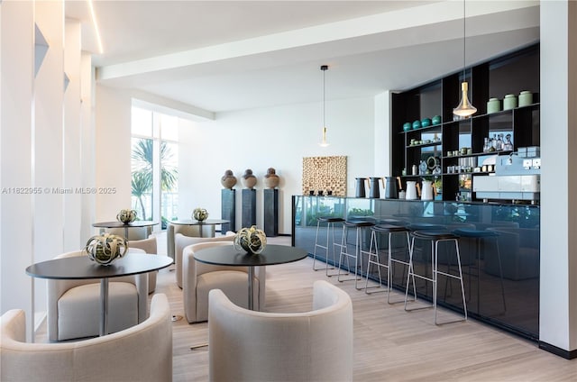4701 N Meridian Ave Unit 217, Miami Beach, FL 33140 - bar area featuring wood finished floors and pendant lighting