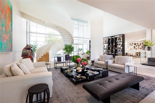 4701 N Meridian Ave Unit 217, Miami Beach, FL 33140 - living area with a high ceiling and wood finished floors