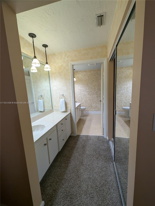 585 SE 25th Ln, Homestead, FL 33033 - bathroom featuring vanity and a textured ceiling