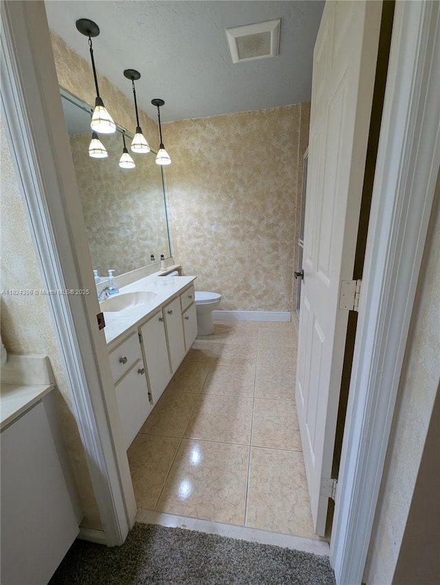 585 SE 25th Ln, Homestead, FL 33033 - bathroom featuring vanity, tile patterned flooring, and wallpapered walls