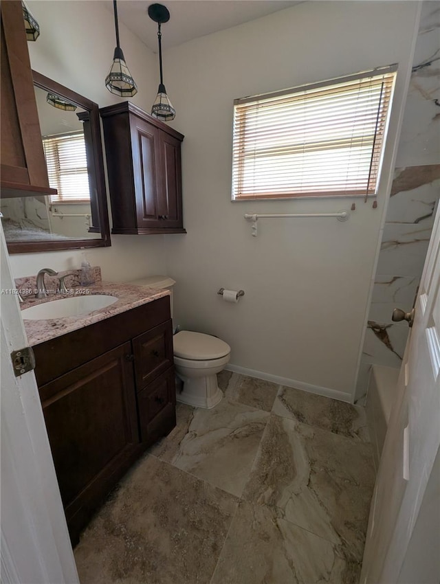 585 SE 25th Ln, Homestead, FL 33033 - bathroom featuring vanity, marble look tiles, plenty of natural light, and shower / bathtub combination