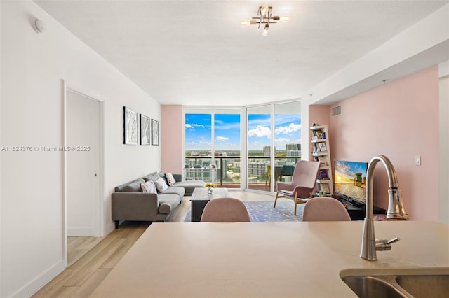 1900 N Bayshore Dr Unit 2514, Miami, FL 33132 - living room featuring expansive windows and light wood-type flooring